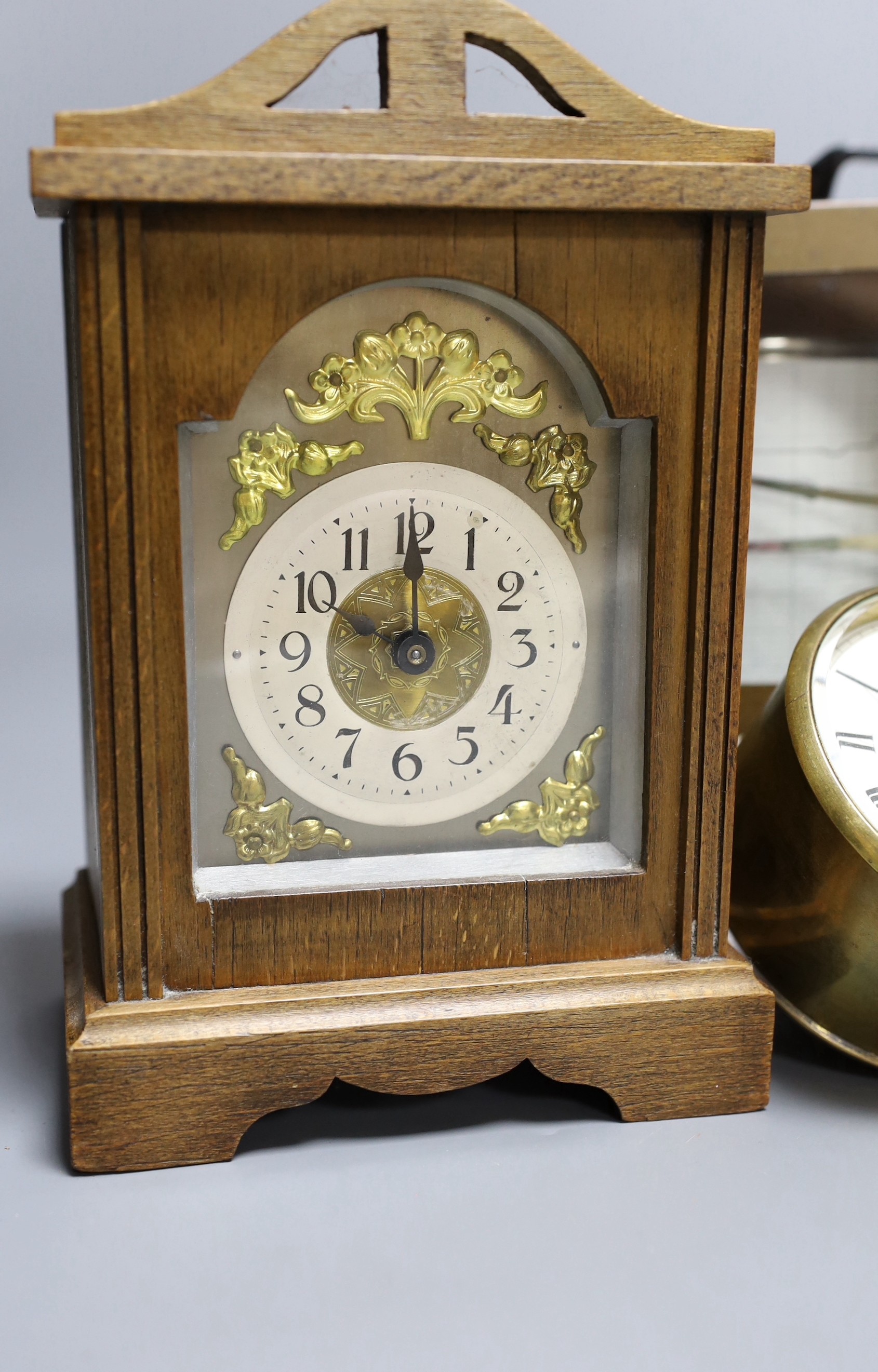 A barograph and three various time pieces including a carriage timepiece, a walnut bracket timepiece and a brass drum timepiece